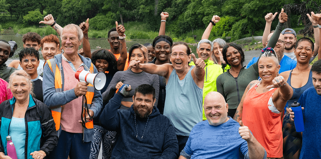 Diverse group of support workers smiling together in hero section